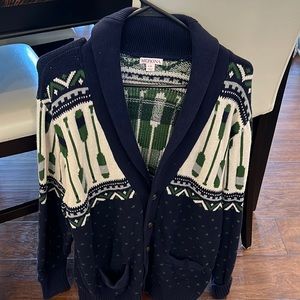 Tacky cardigan with canoe paddles